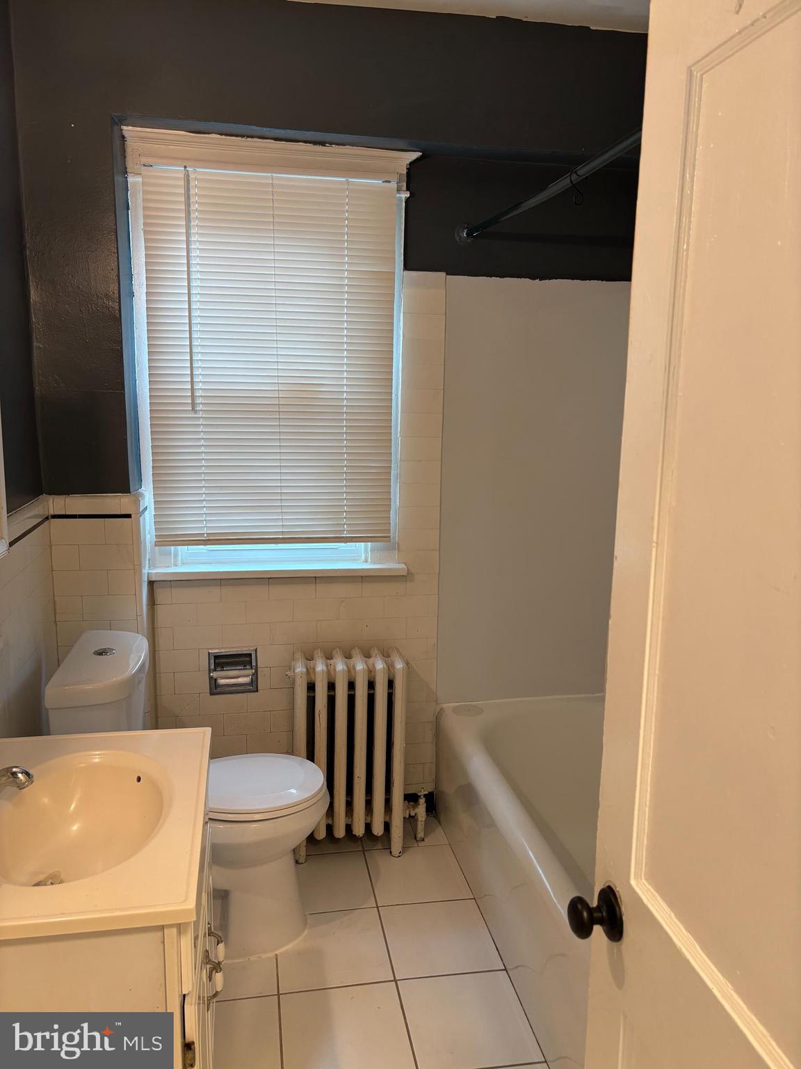 633 Edge Hill Road, Unit 1 Glenside, PA 19038 - Photo 8 of 13 a bathroom with a sink a toilet and bathtub