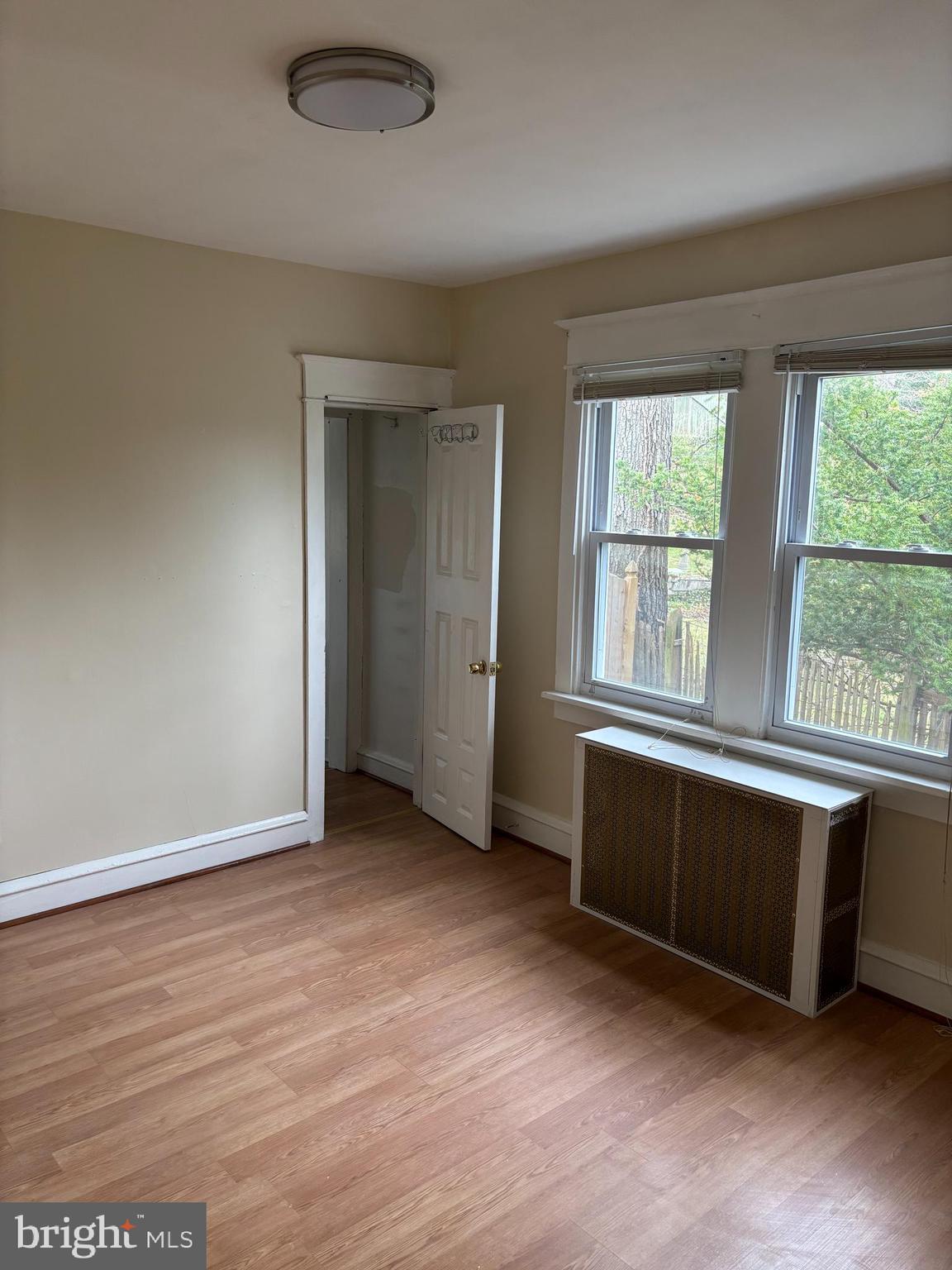 633 Edge Hill Road, Unit 1 Glenside, PA 19038 - Photo 9 of 13 an empty room with wooden floor and windows