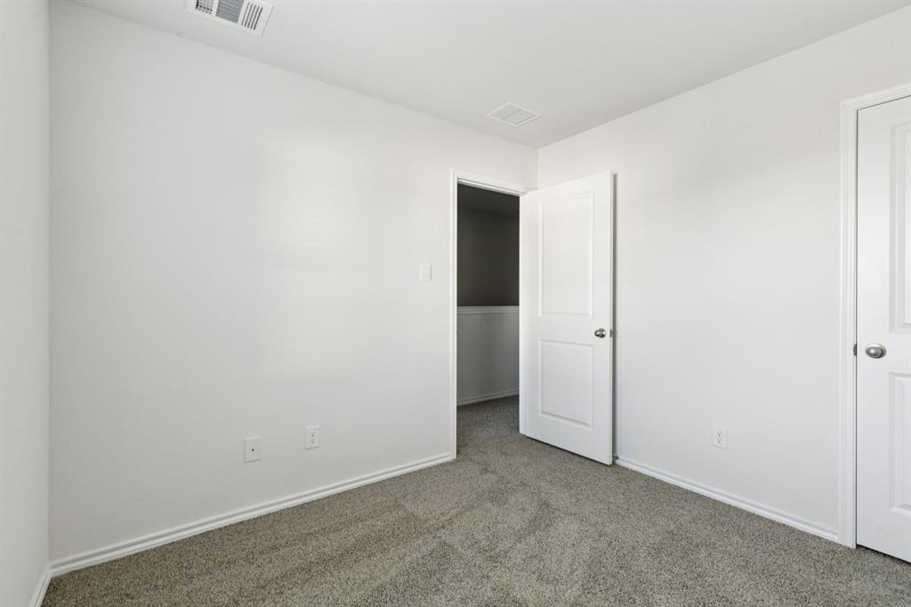 317 Clematis Street Princeton, TX 75407 - Photo 29 of 38 Unfurnished bedroom with carpet flooring and baseboards