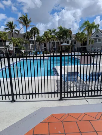 a view of balcony with wooden floor and city view