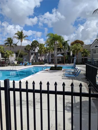 a view of swimming pool with outdoor seating