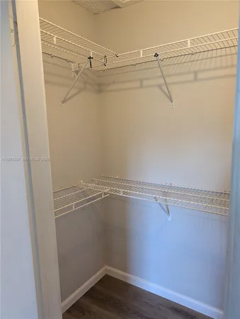 a view of a room with racks on the wall