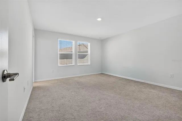 a bathroom with a double vanity sink mirror and toilet