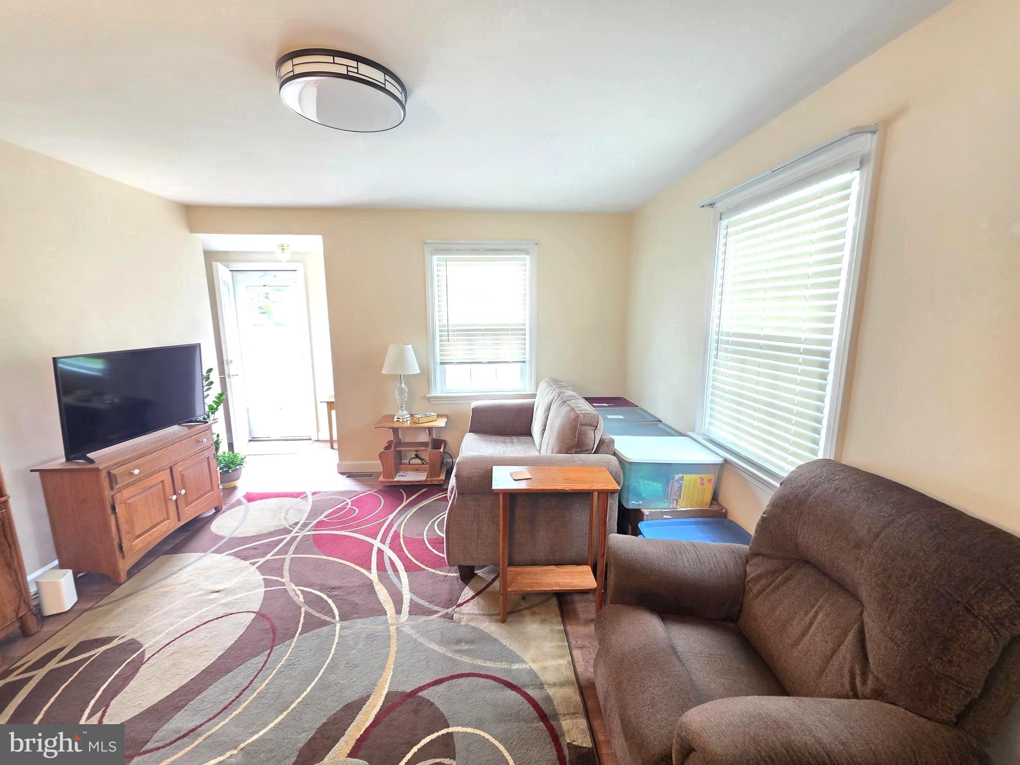 27 George Street Mount Ephraim, NJ 08059 - Photo 7 of 27 a living room with furniture and a flat screen tv
