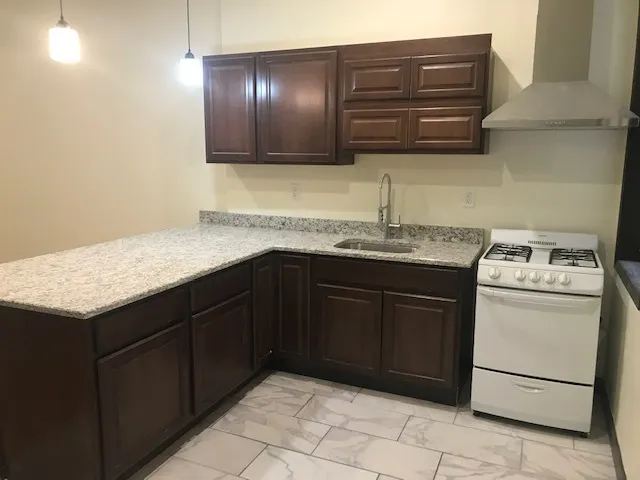 a kitchen with a sink and cabinets