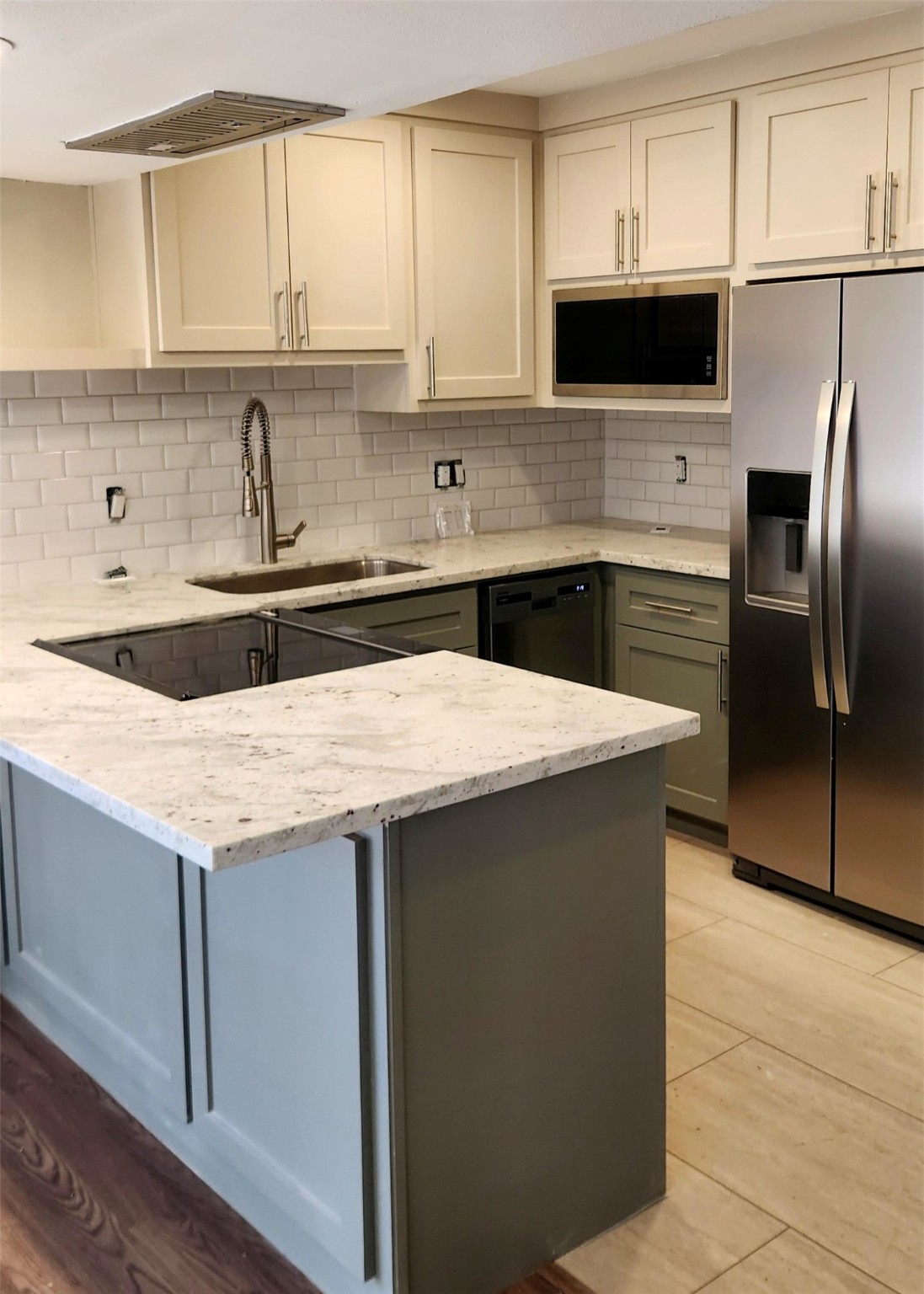 909 Silber Road, Unit 27E Houston, TX 77024 - Photo 1 of 15 a kitchen with granite countertop a sink and a stove top oven