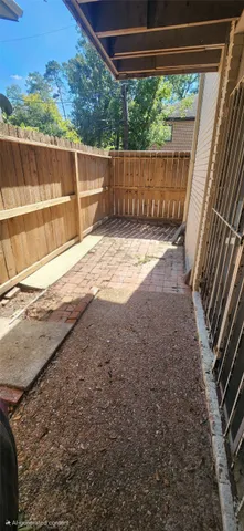 a view of a backyard with wooden floor and outdoor space