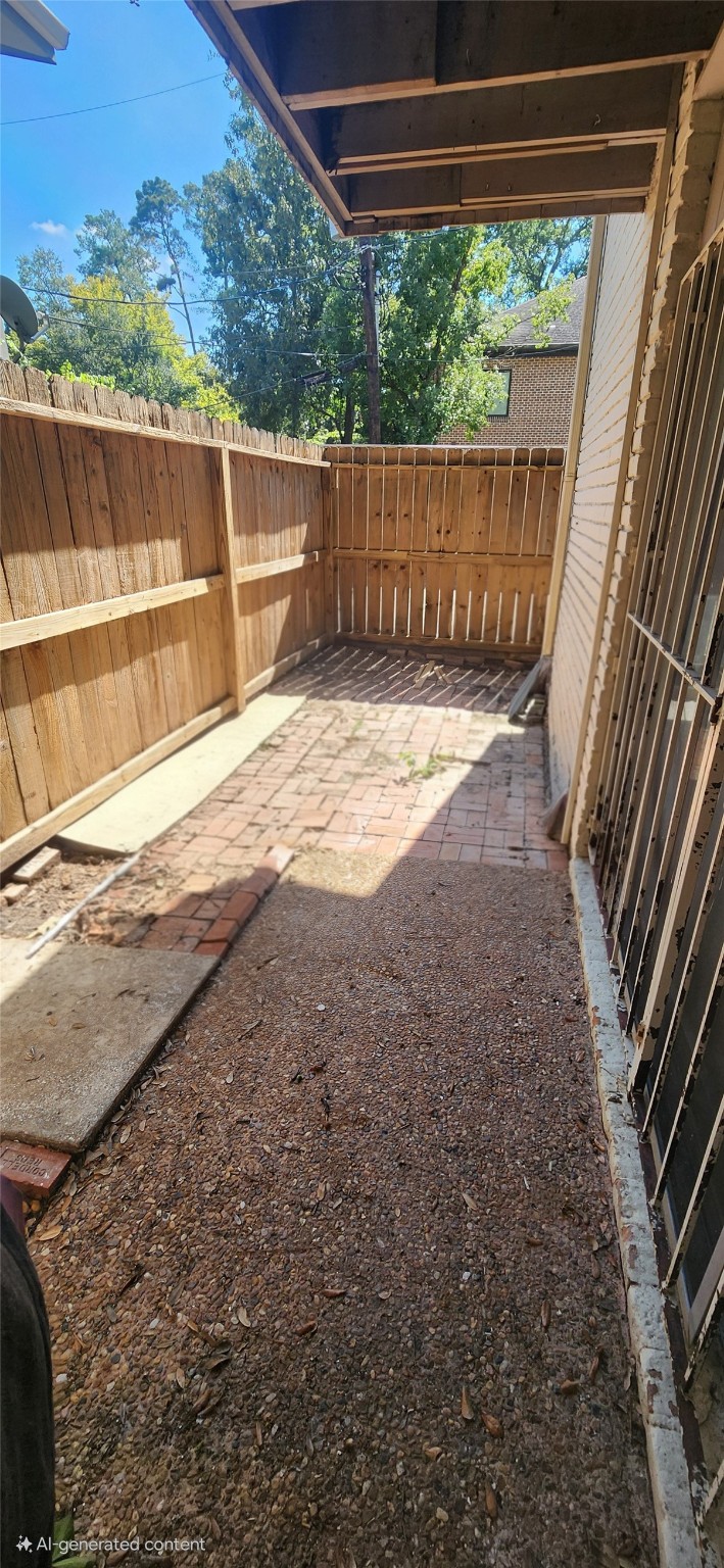 909 Silber Road, Unit 27E Houston, TX 77024 - Photo 14 of 15 a view of a backyard with wooden floor and outdoor space