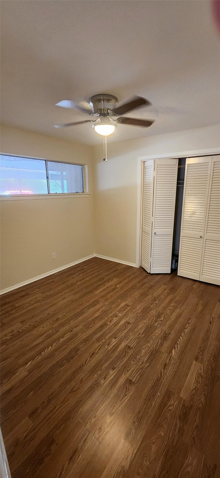 909 Silber Road, Unit 27E Houston, TX 77024 - Photo 10 of 15 a view of empty room with wooden floor