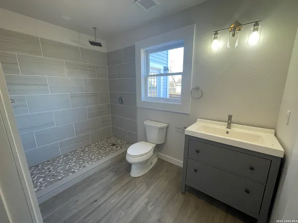 a bathroom with a sink and a toilet