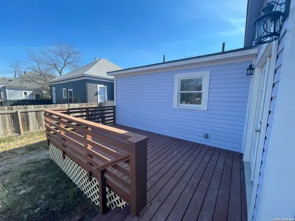 a view of a roof deck with wooden floor