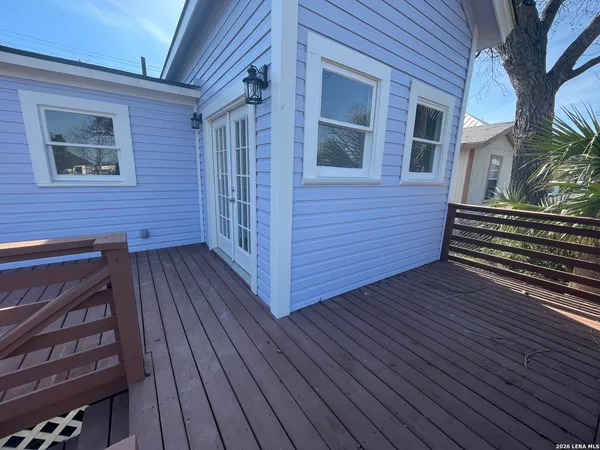 a view of outdoor space and deck with wooden floor