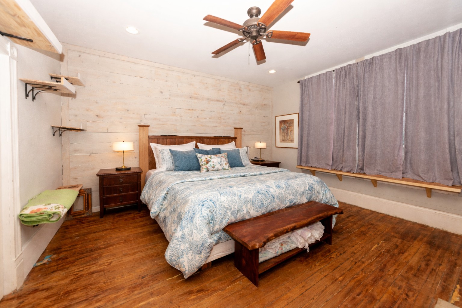1202 Pecan Street Bastrop, TX 78602 - Photo 13 of 38 a spacious bedroom with a bed and a chandelier