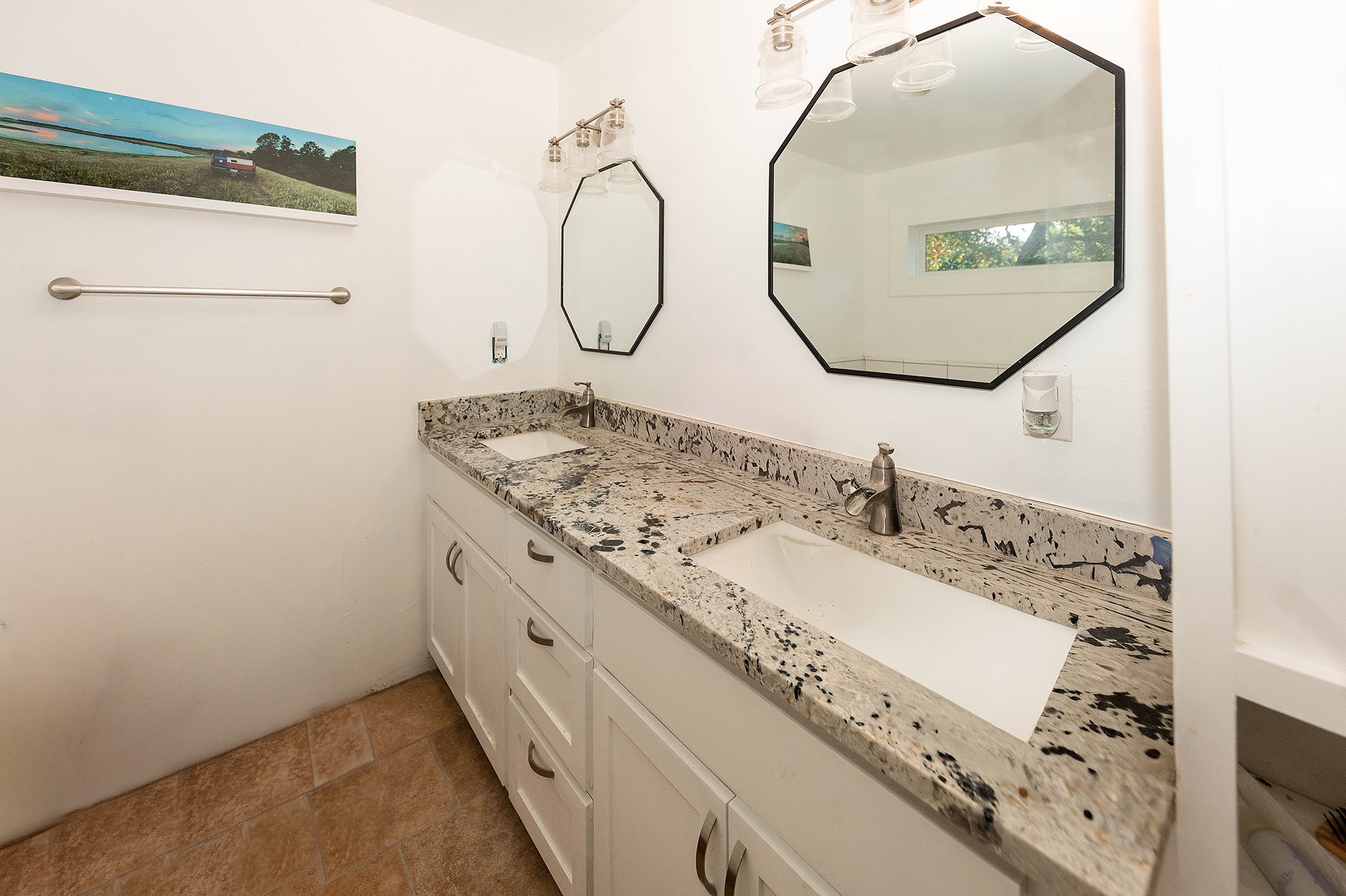 1202 Pecan Street Bastrop, TX 78602 - Photo 15 of 38 a bathroom with a granite countertop sink mirror and vanity
