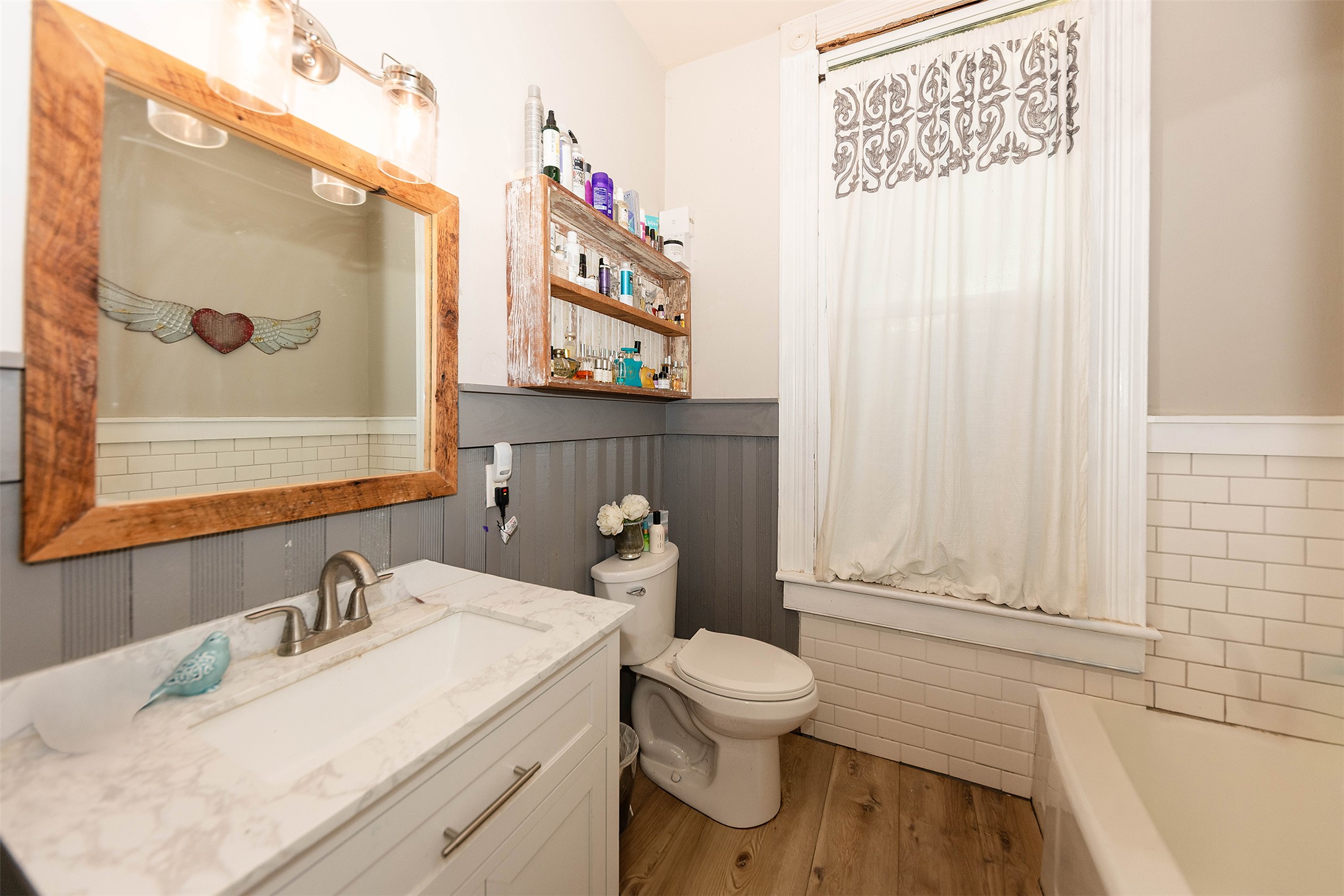 1202 Pecan Street Bastrop, TX 78602 - Photo 19 of 38 a bathroom with a sink and a toilet