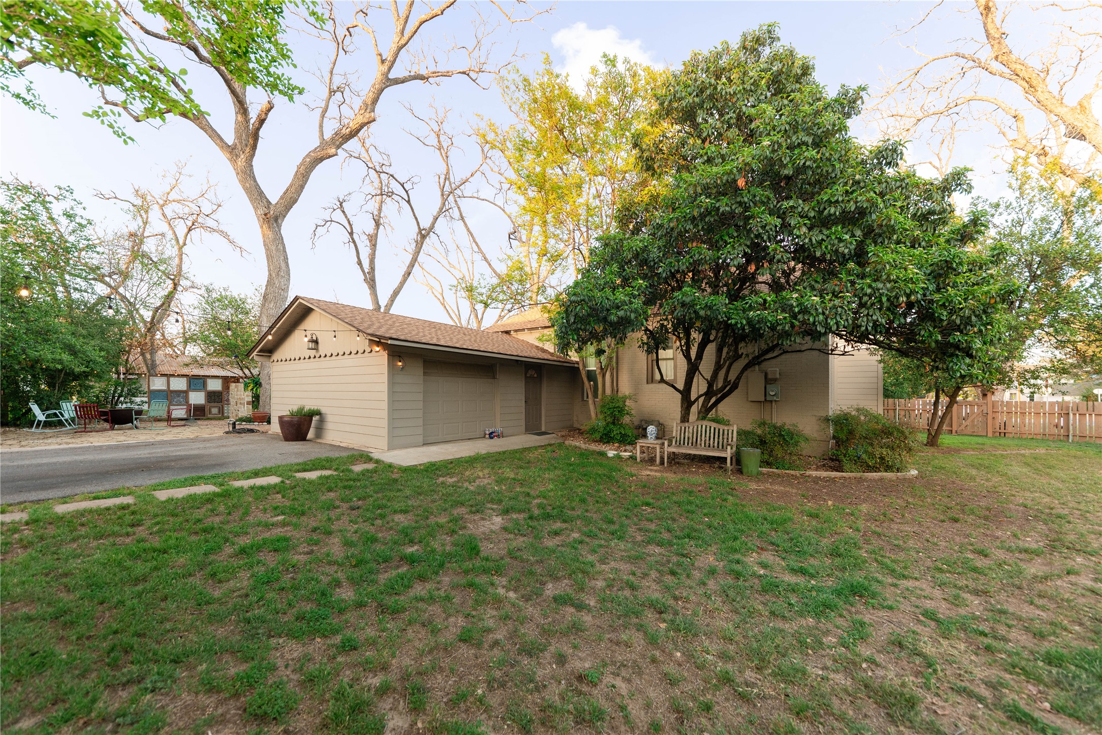 1202 Pecan Street Bastrop, TX 78602 - Photo 29 of 38 a house that has a tree in front of it