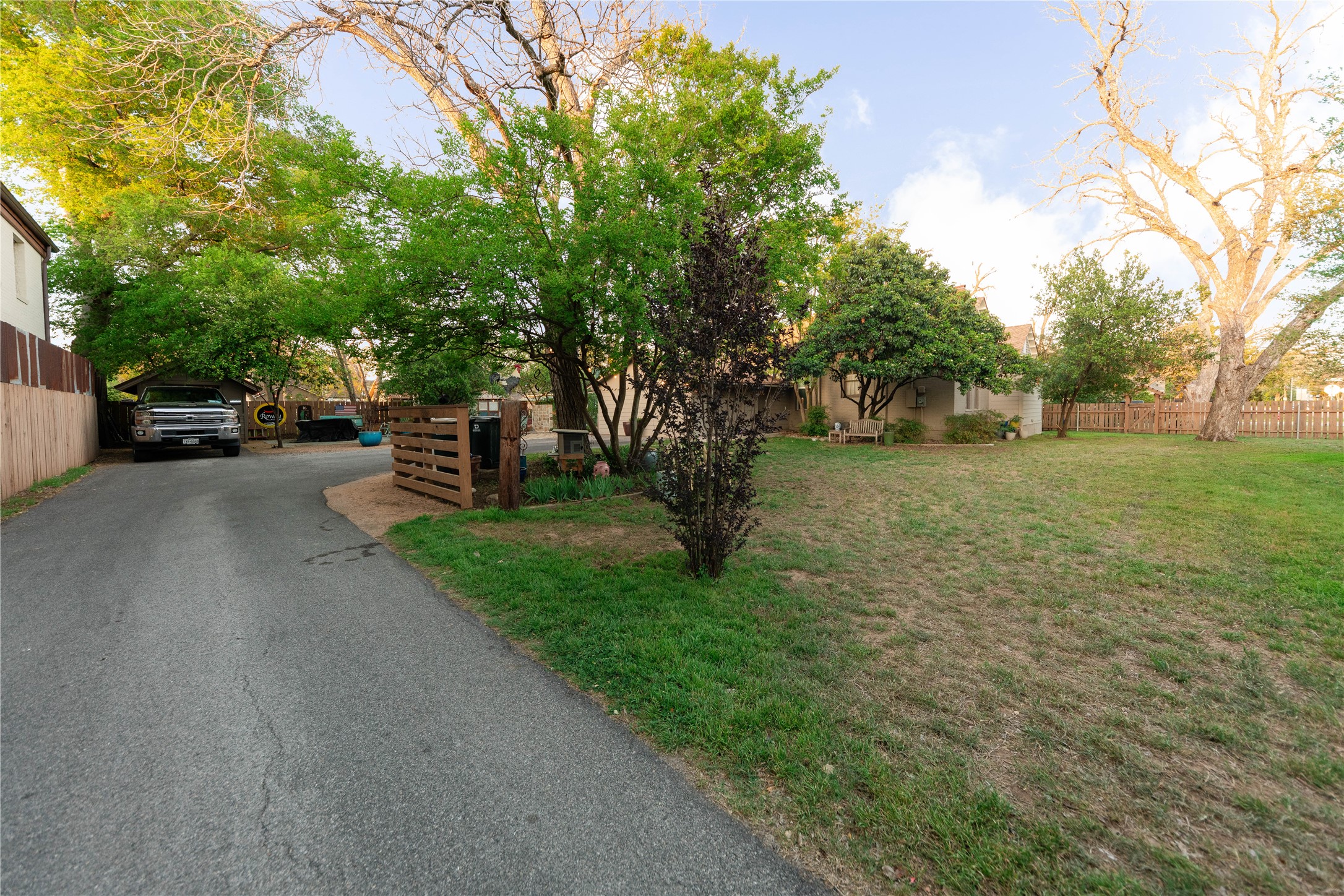 1202 Pecan Street Bastrop, TX 78602 - Photo 31 of 38 a view of a yard with a tree