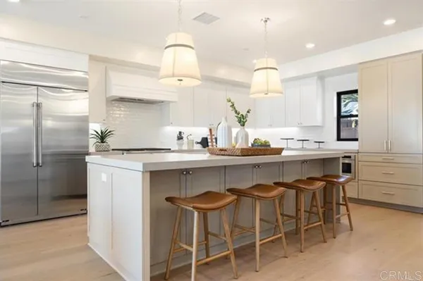 a kitchen with a sink cabinets and window