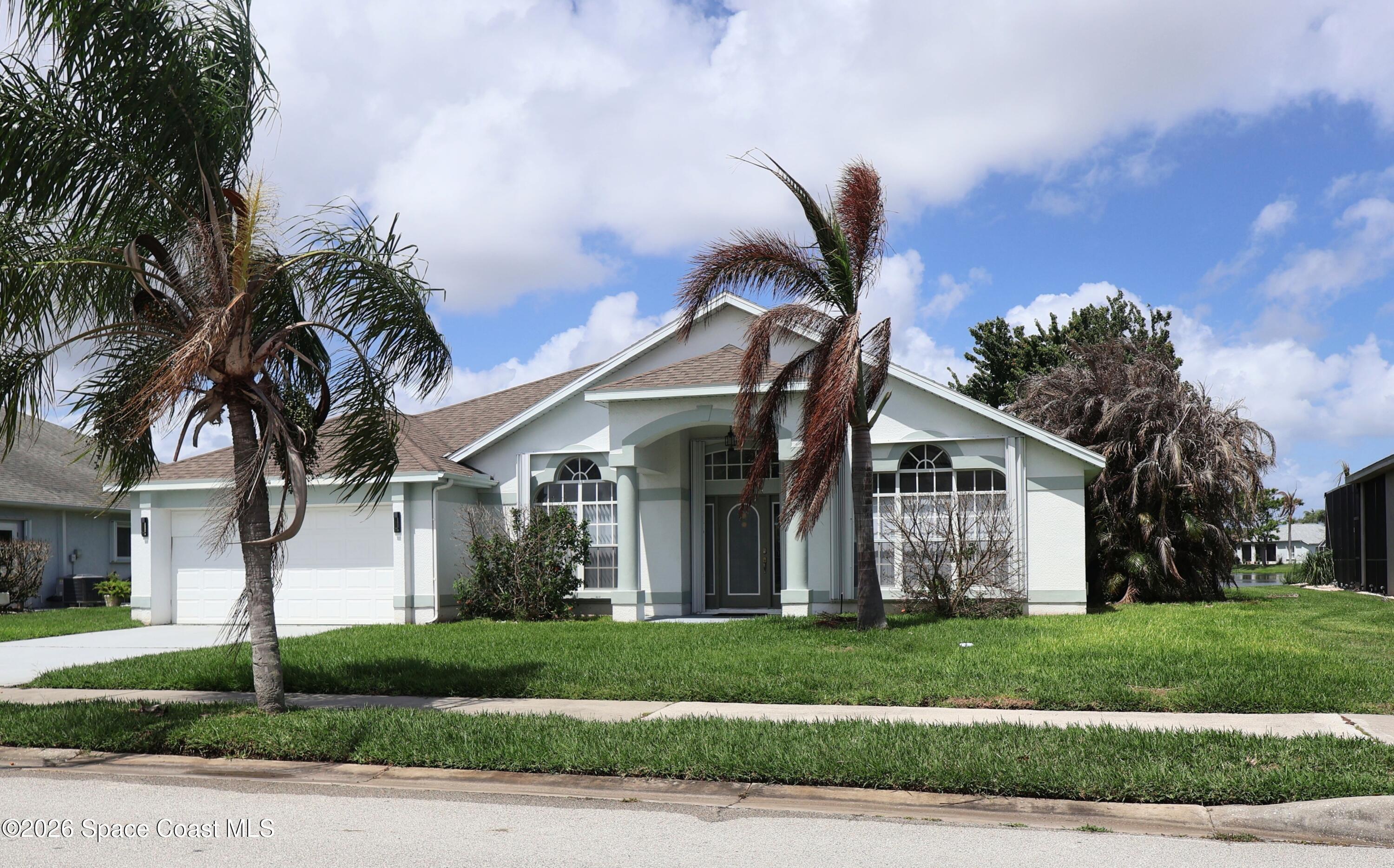 704 Carriage Hill Road Melbourne, FL 32940 - Photo 2 of 59 Front