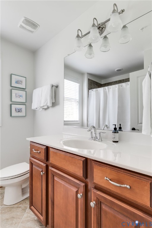 3900 Redbud Road Glen Allen, VA 23060 - Photo 28 of 37 a bathroom with a granite countertop sink a toilet and a mirror