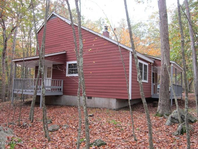 245 Eagle Rock Road Lackawaxen, PA 18435 - Photo 3 of 4 a view of a house with a yard and wooden deck