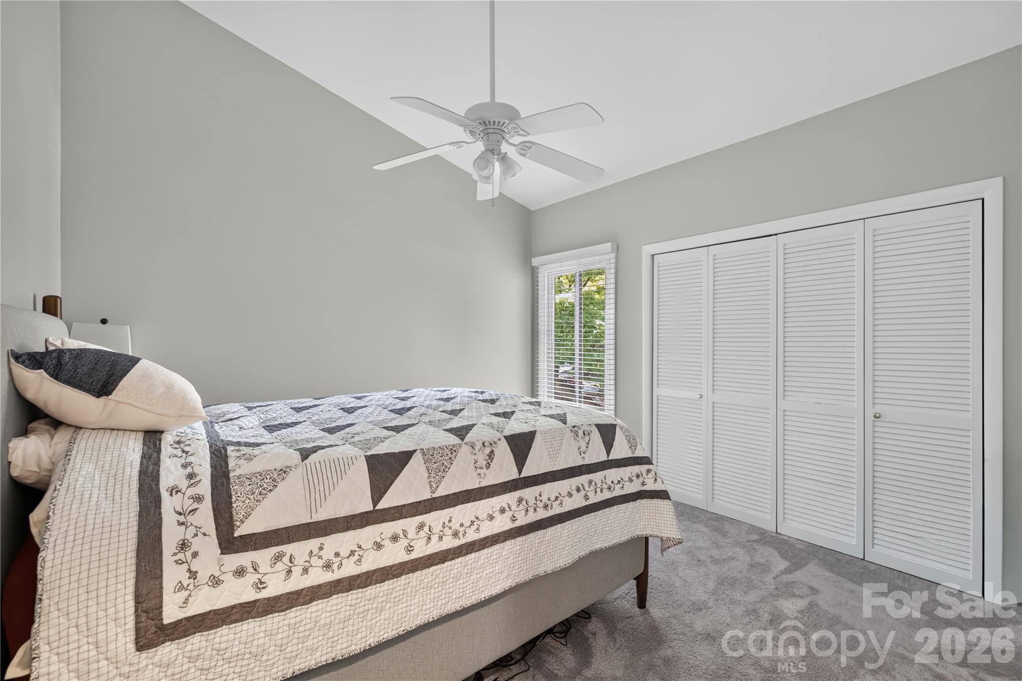 185 Riverview Terrace Clover, SC 29710 - Photo 21 of 35 a bed sitting in a bedroom next to a window