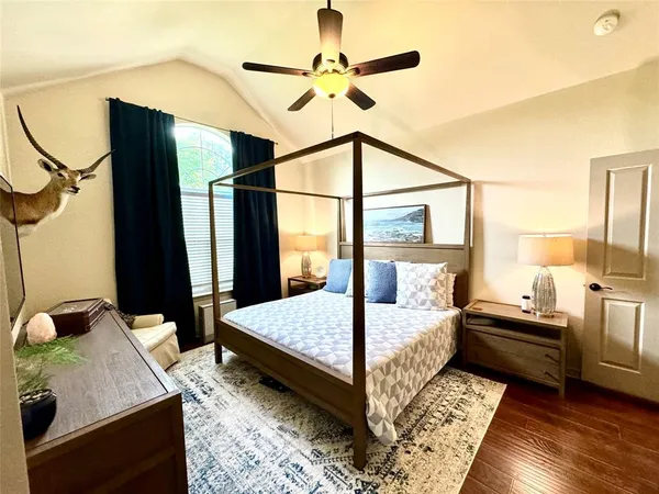 a bedroom with a bed next to a window with the outer view