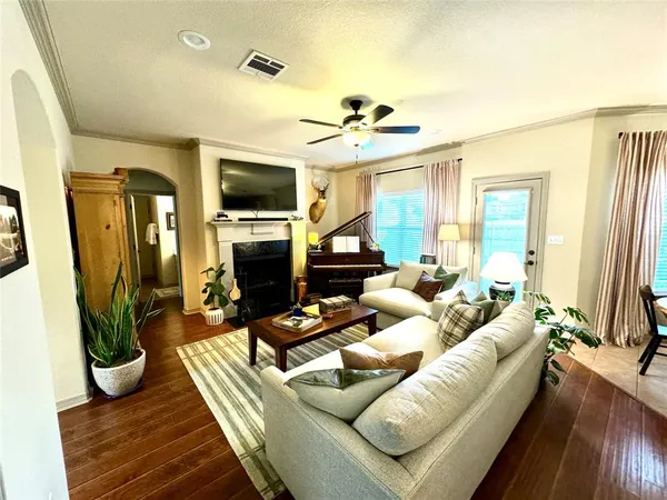 a living room with furniture fireplace and a flat screen tv