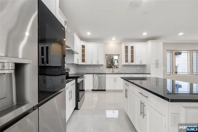a bathroom with a toilet a sink and a window