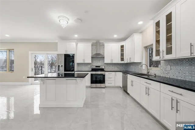 a view of wooden floor and windows in an empty room