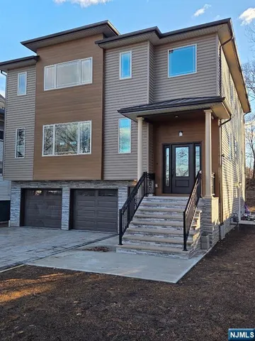 a front view of a house with yard