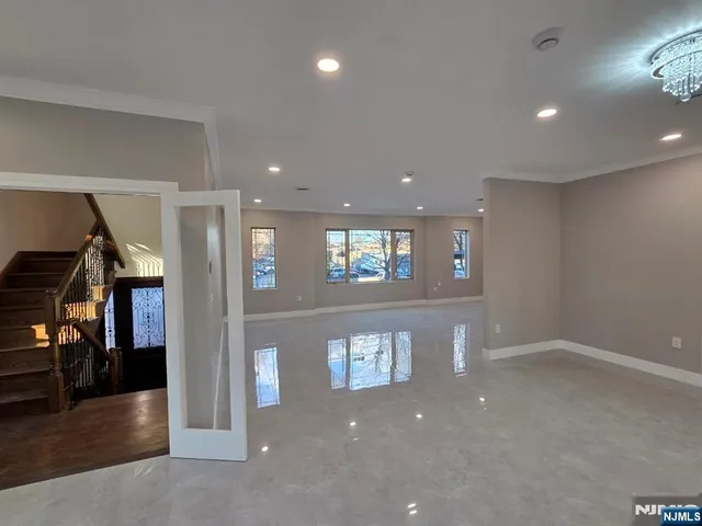 a kitchen with stainless steel appliances granite countertop a sink and cabinets