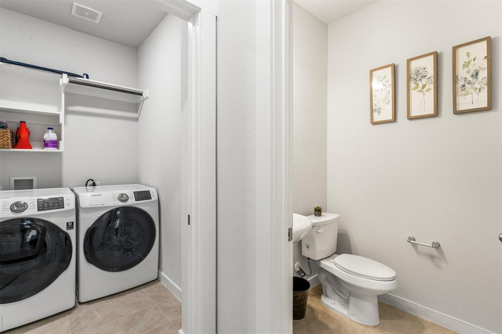 2407 Neff Lane Forney, TX 75126 - Photo 20 of 22 a bathroom with a washer and dryer
