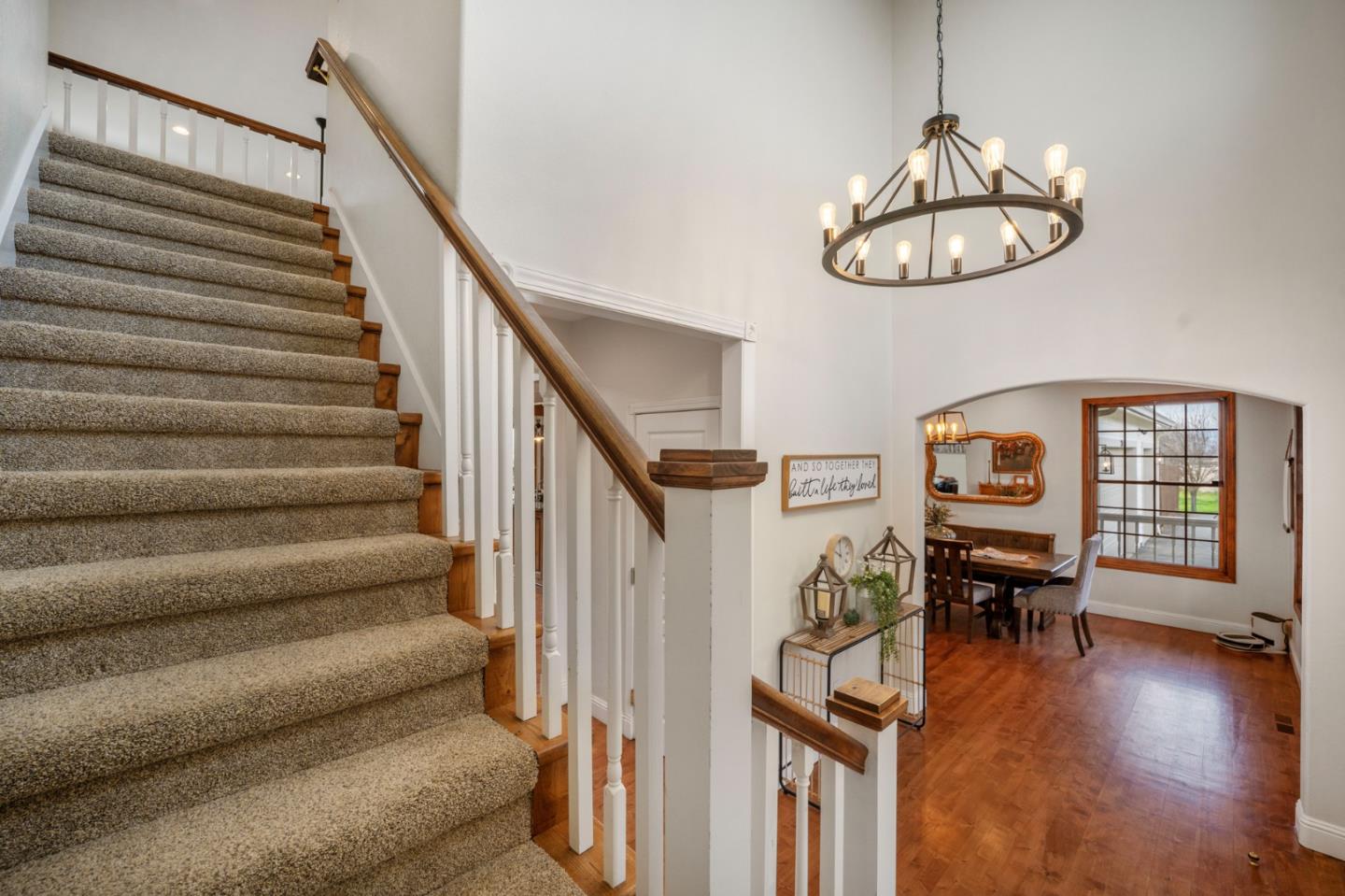 2760 Leavesley Road Gilroy, CA 95020 - Photo 18 of 77 a view of a livingroom with furniture wooden floor staircase and windows