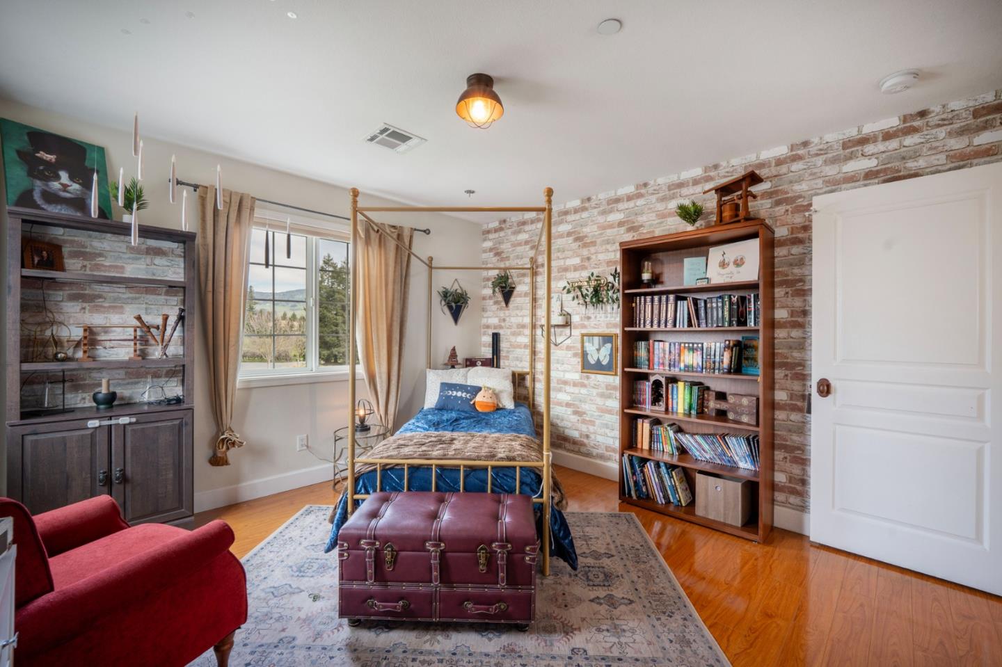 2760 Leavesley Road Gilroy, CA 95020 - Photo 27 of 77 a living room with furniture a rug and a book shelf