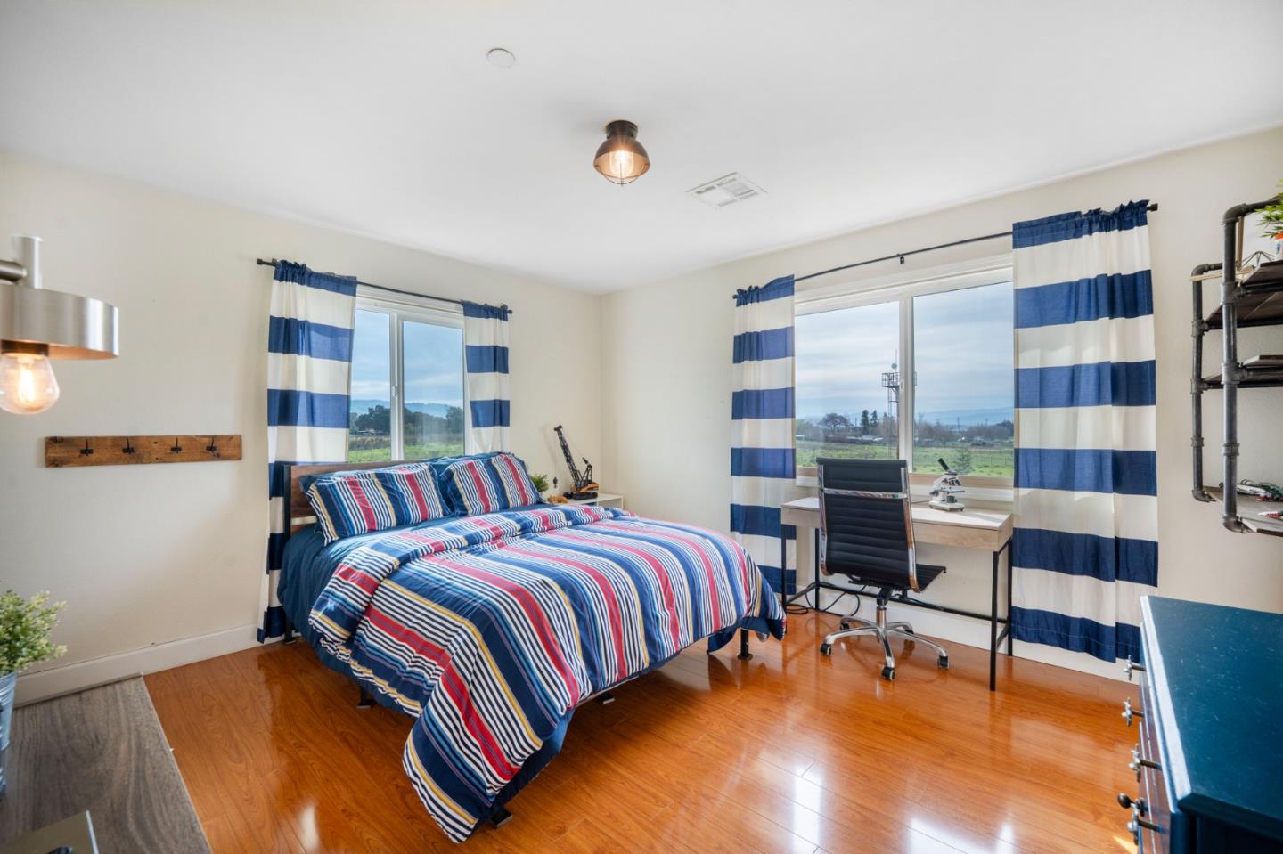 2760 Leavesley Road Gilroy, CA 95020 - Photo 29 of 77 a bedroom with a bed and a bookshelf