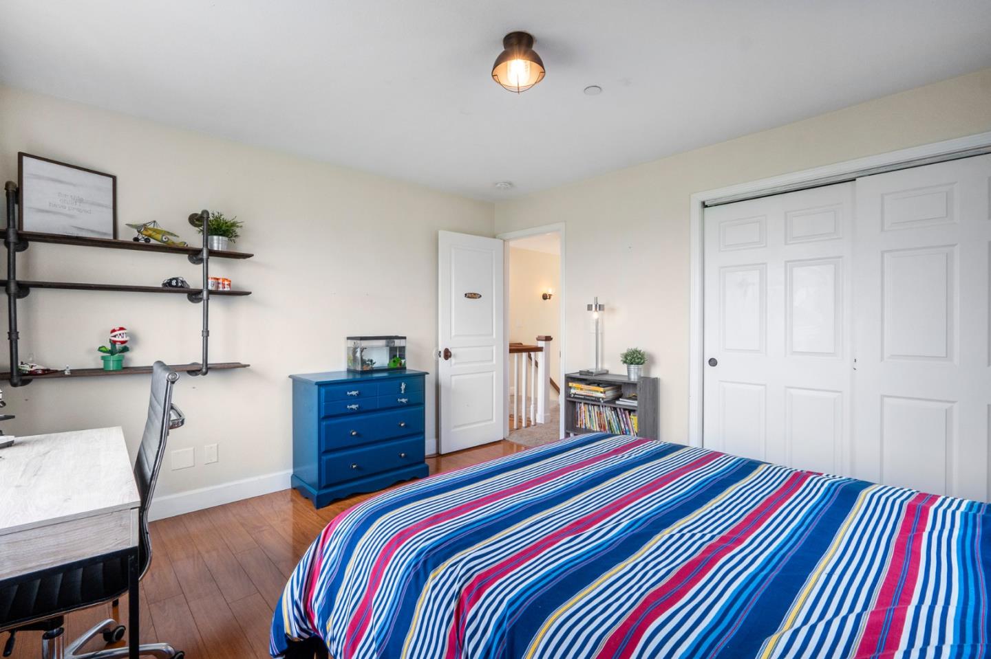 2760 Leavesley Road Gilroy, CA 95020 - Photo 31 of 77 a bedroom with a bed and a dresser in it