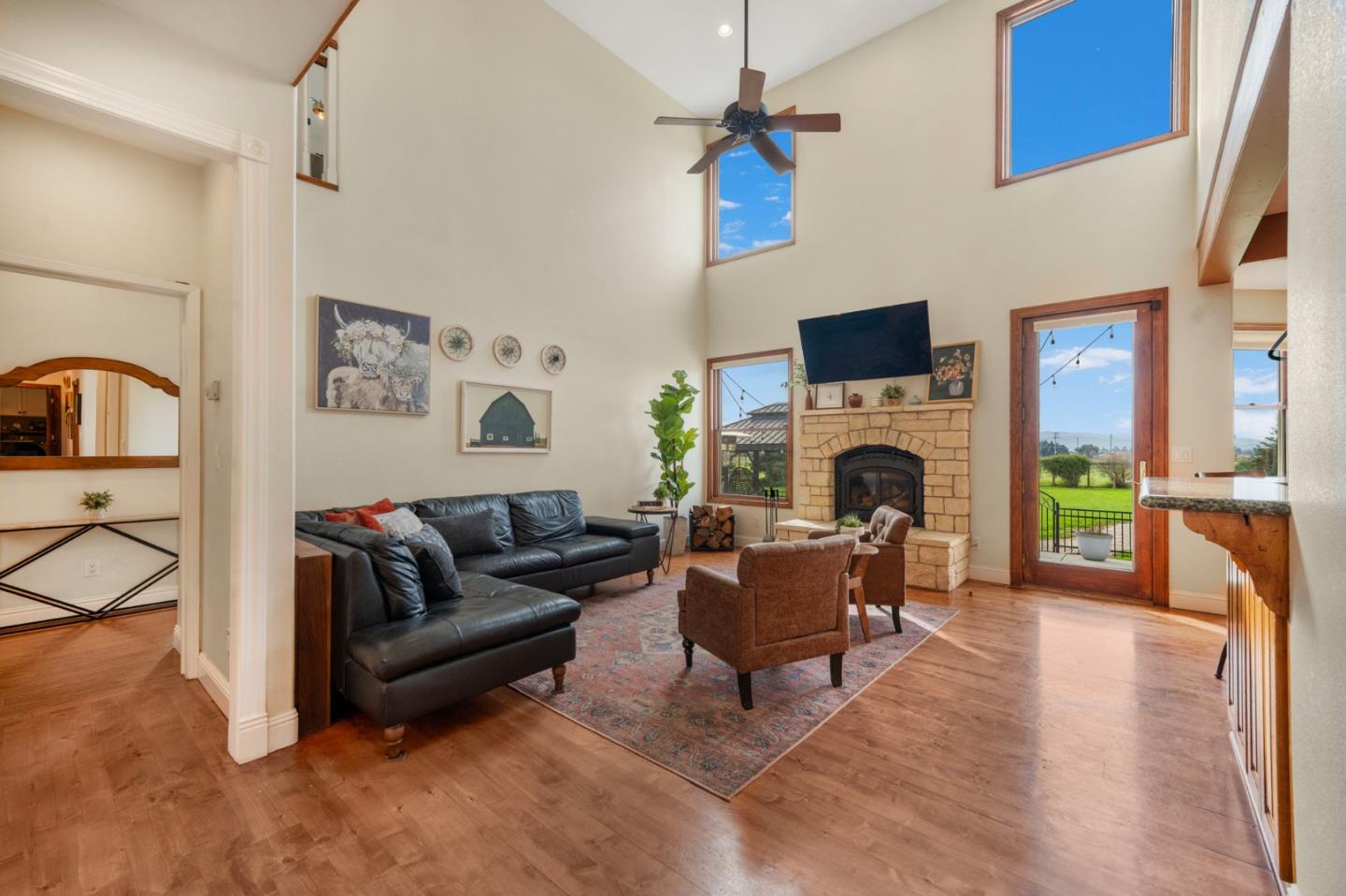 2760 Leavesley Road Gilroy, CA 95020 - Photo 4 of 77 a living room with furniture a fireplace and a flat screen tv