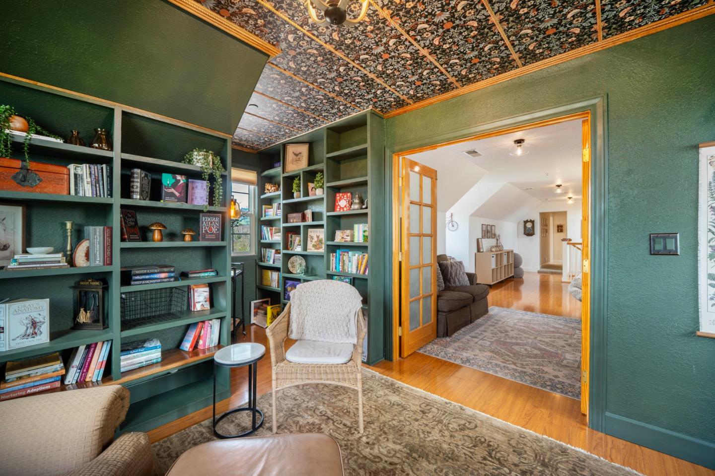 2760 Leavesley Road Gilroy, CA 95020 - Photo 51 of 77 a living room with lots of furniture and a book shelf