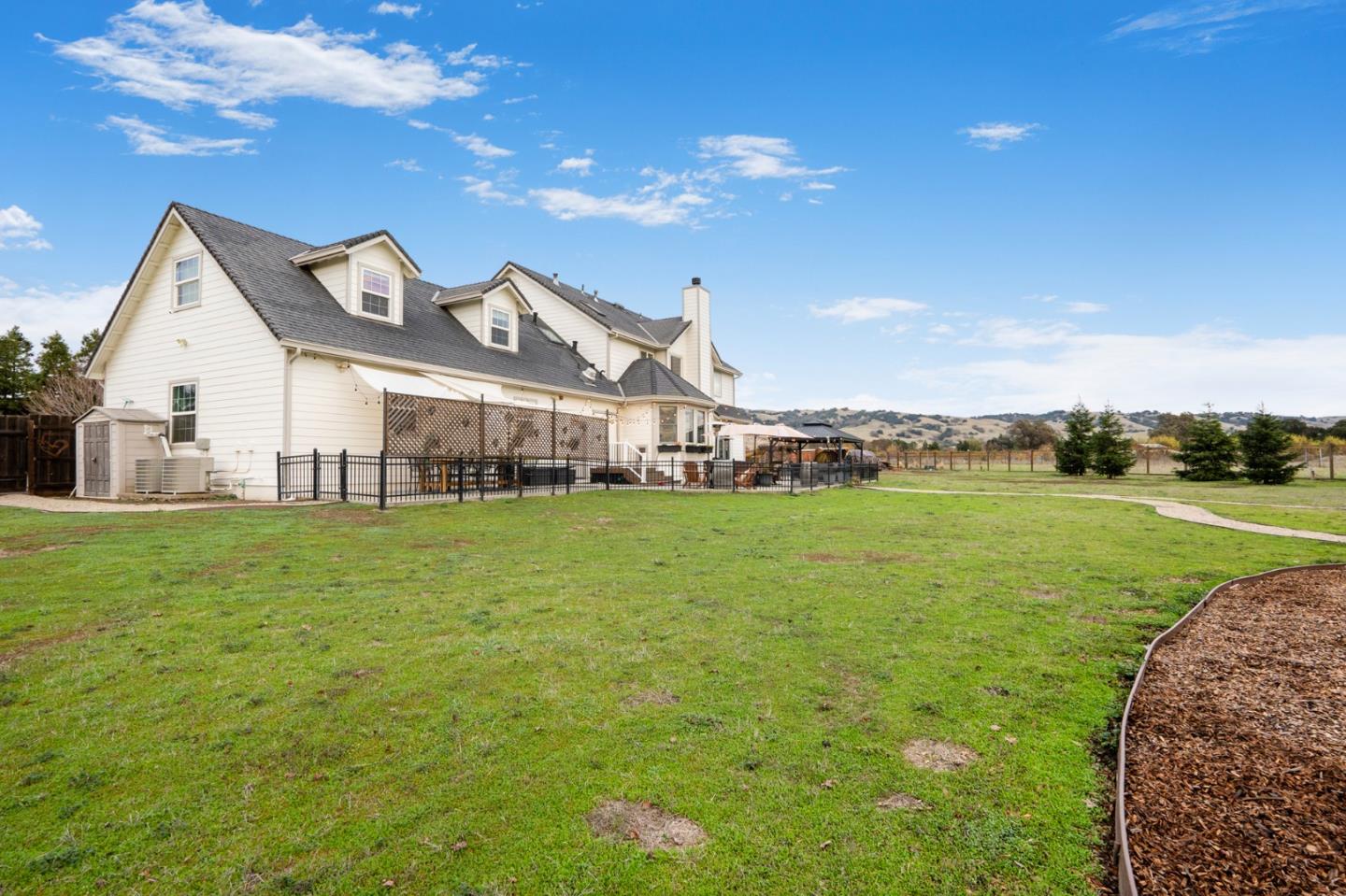 2760 Leavesley Road Gilroy, CA 95020 - Photo 59 of 77 a view of a big house with a big yard and potted plants