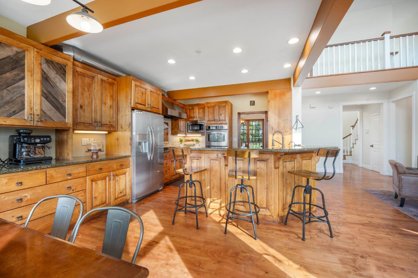 2760 Leavesley Road Gilroy, CA 95020 - Photo 10 of 77 a view of a dining room with furniture a kitchen and chandelier