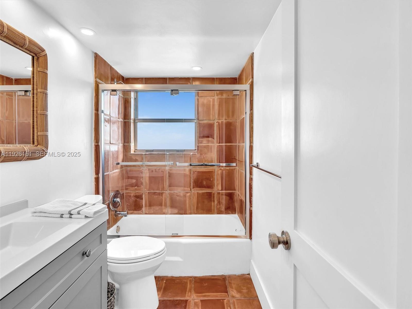 1881 Washington Avenue, Unit 16E Miami Beach, FL 33139 - Photo 32 of 65 a bathroom with a sink a toilet and shower