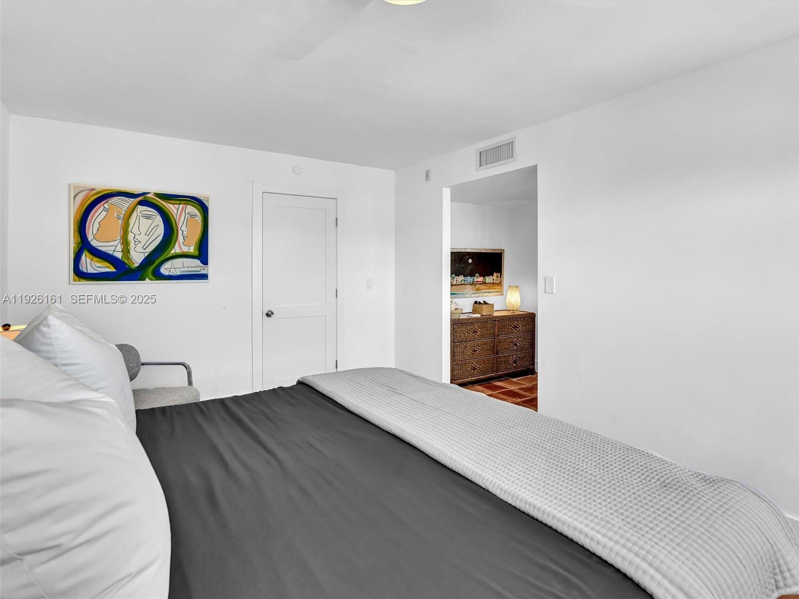 1881 Washington Avenue, Unit 16E Miami Beach, FL 33139 - Photo 42 of 65 a view of an empty room and wooden floor