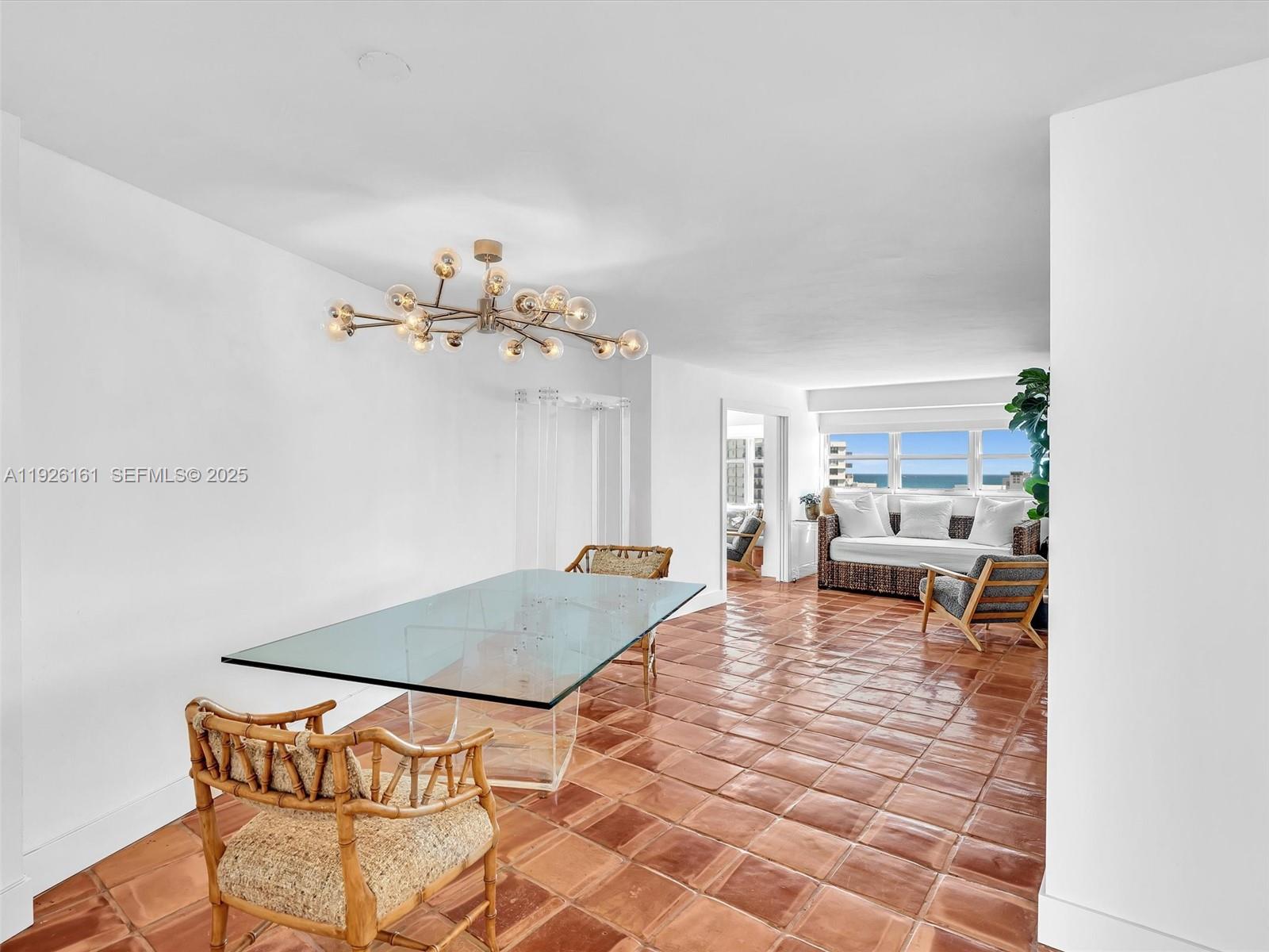 1881 Washington Avenue, Unit 16E Miami Beach, FL 33139 - Photo 6 of 65 a living room with furniture and a dining table