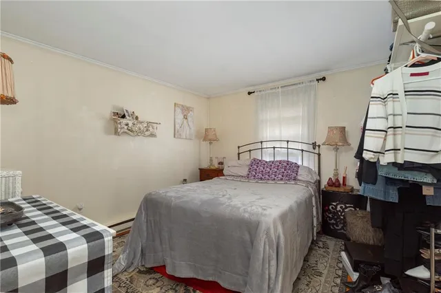 a bedroom with a bed and cabinets