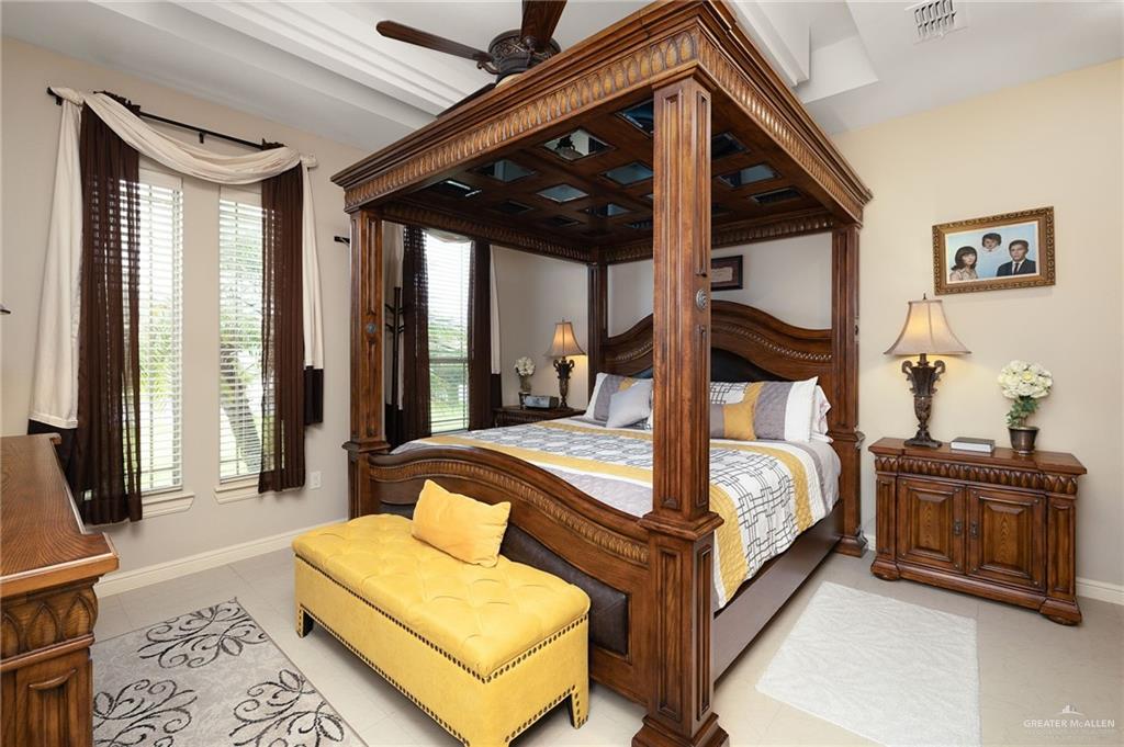 704 Santa Fe Street Weslaco, TX 78596 - Photo 19 of 25 a bed room with a bed and a potted plant