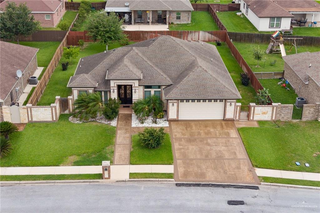 704 Santa Fe Street Weslaco, TX 78596 - Photo 2 of 25 front view of house with a yard