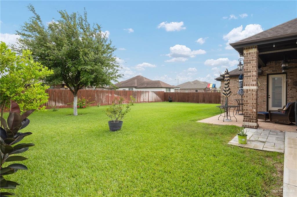 704 Santa Fe Street Weslaco, TX 78596 - Photo 23 of 25 a view of an house with backyard space and garden