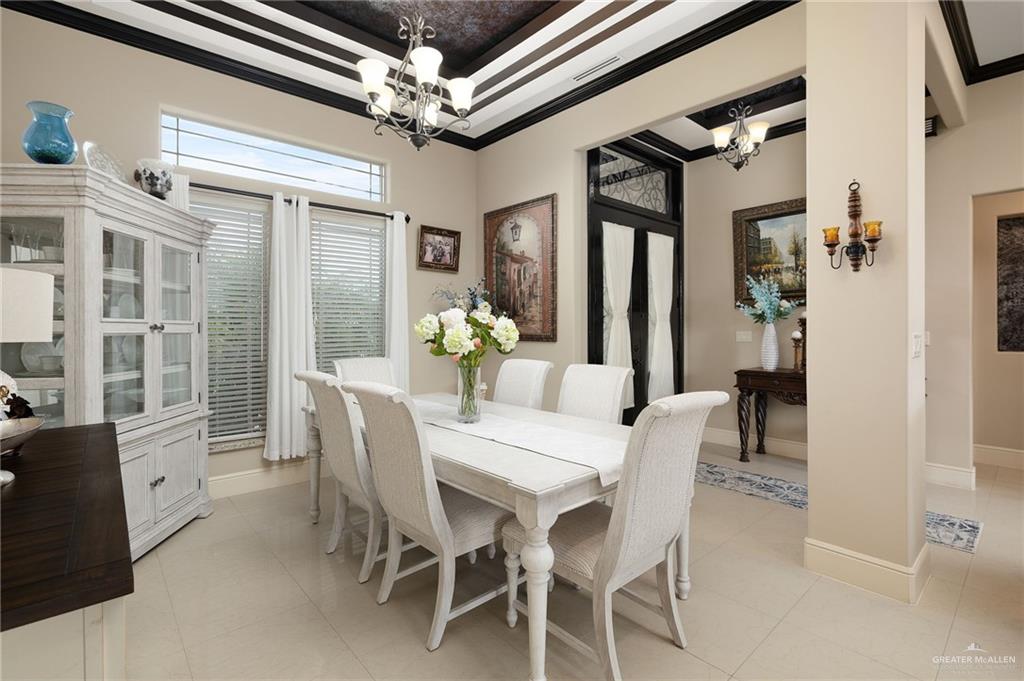 704 Santa Fe Street Weslaco, TX 78596 - Photo 6 of 25 a dining room with furniture and window