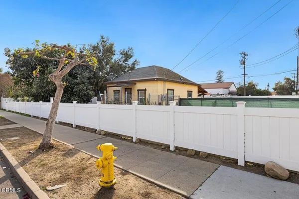 a front view of a house with trees